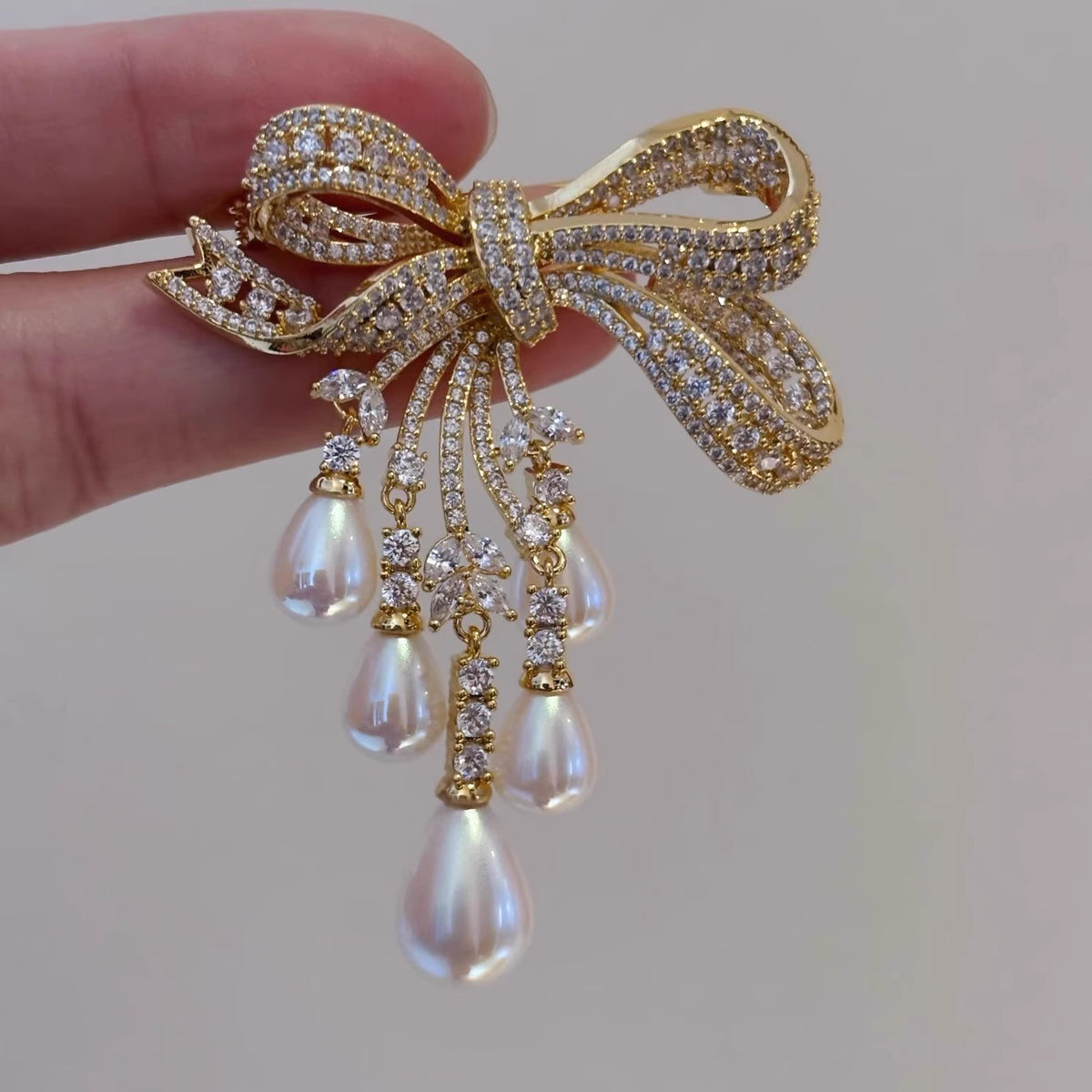 Affordable Luxury Full-Pavé Bow and Pearl Brooch