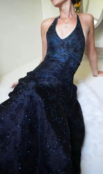 Close-up of high-quality floral lace texture on a deep purple formal dress, intricate lace detailing for luxury prom gowns.